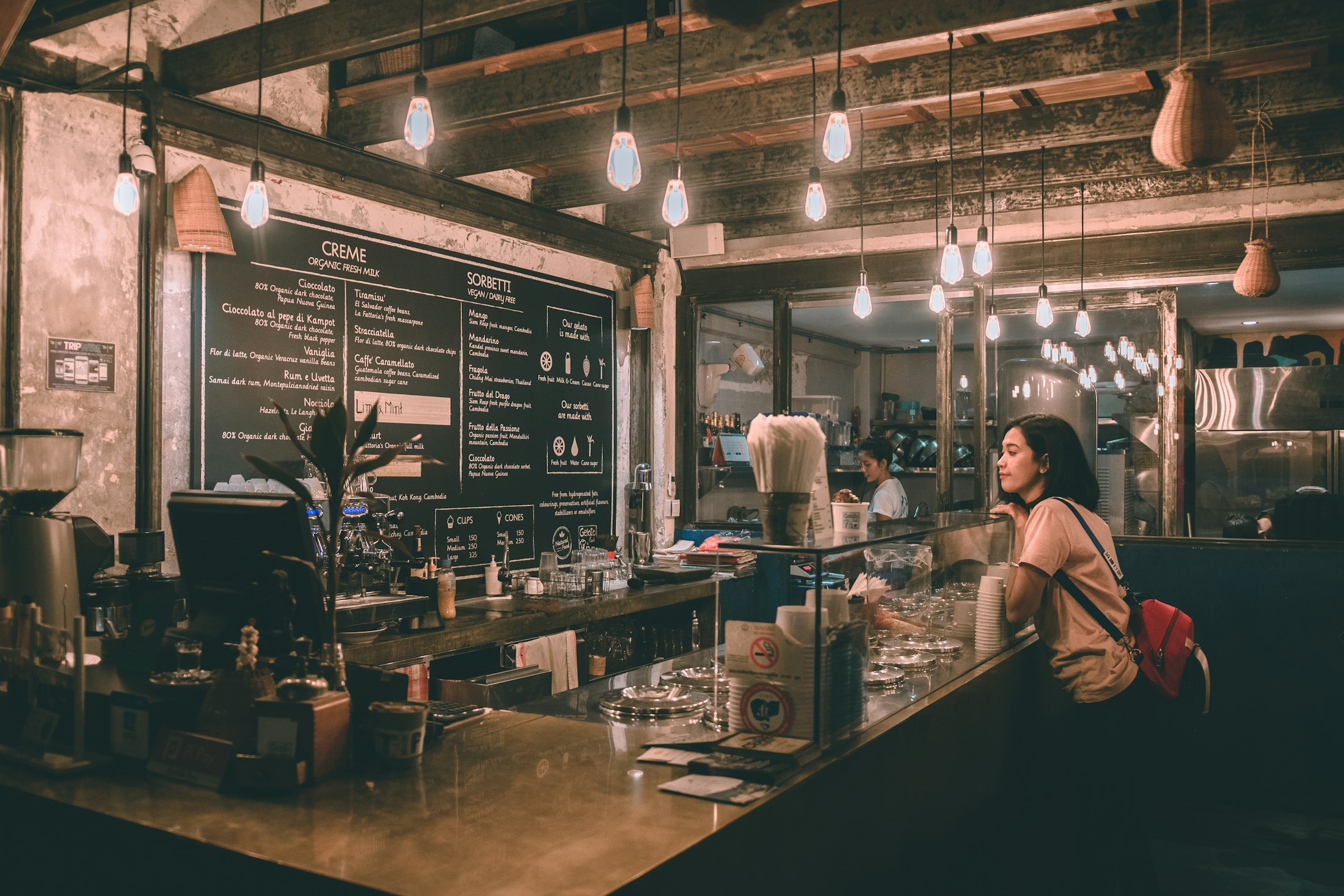 A café interior glowing at night